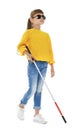 Blind girl with long cane walking on white