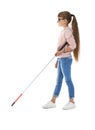 Blind girl with long cane walking on white