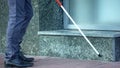 Blind man finding obstructions with cane, difficulties for handicapped in cities Royalty Free Stock Photo