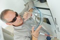 Blind man in kitchen at home