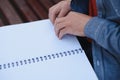 Blind man reading braille book, sitting on bench in summer park, resting Royalty Free Stock Photo