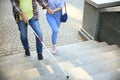 Blind mature man with his daughter walking outdoors Royalty Free Stock Photo