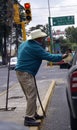 Blind mexican man begs in the street