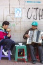 Blind musicians playing music in the street of Quito, Colombia.