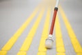 Blind pedestrian walking on tactile paving