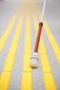 Blind pedestrian walking on tactile paving