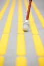 Blind pedestrian walking on tactile paving