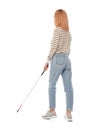 Blind person with long cane walking on white Royalty Free Stock Photo