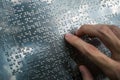 Blind person reading braille text Royalty Free Stock Photo