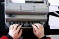 Blind person typing on a braille typing machine Royalty Free Stock Photo