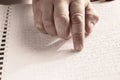 Blind reading text in braille language Royalty Free Stock Photo