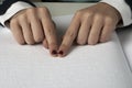 Blind reading text in braille language Royalty Free Stock Photo