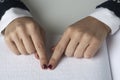 Blind reading text in braille language Royalty Free Stock Photo