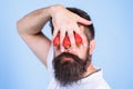 Blind of strawberry. Man bearded hipster hold hand with strawberries in front of eyes. Glance of man blocked by berries Royalty Free Stock Photo