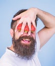 Blind of strawberry. Man bearded hipster hold hand with strawberries in front of eyes. Strawberry on my mind. Man can Royalty Free Stock Photo