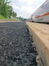 blind track in yellow with a train in the background