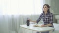 A blind, visually impaired beautiful young woman reads a book, uses a voice Royalty Free Stock Photo