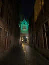 Blinde-Ezelstraat blind donkey street arch bridge illuminated dark narrow cobblestone alley at night in Bruges Belgium Royalty Free Stock Photo