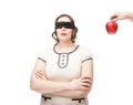 Blindfold plus size woman temptating with apple Royalty Free Stock Photo