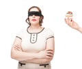 Blindfold plus size woman temptating with pastry Royalty Free Stock Photo