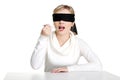 Blindfold woman holding spoon with pile of pills Royalty Free Stock Photo