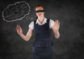 Blindfolded business woman with thought cloud showing math doodles against grey wall