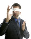 Blindfolded businessman over white background Royalty Free Stock Photo