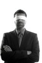 Blindfolded businessman over white background Royalty Free Stock Photo