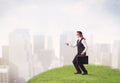 Blindfolded businessman steps on patch of grass Royalty Free Stock Photo