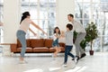 Blindfolded mother and father with children playing hide and seek. Royalty Free Stock Photo