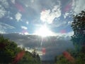 Blinding of a Sun through the wet, dirty windshield of a car, while driving Royalty Free Stock Photo