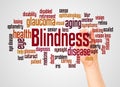 Blindness word cloud and hand with marker concept