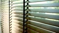 Blinds, Evening sun light outside window blinds, sunshine and shadow on window blind, decorative interior in home Royalty Free Stock Photo