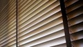 Blinds, Evening sun light outside wooden window blinds, sunshine and shadow on window blind. Royalty Free Stock Photo