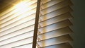 Blinds, Evening sun light outside wooden window blinds, sunshine and shadow on window blind. Royalty Free Stock Photo