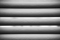 Blinds in front of a window in black and white