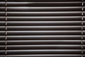Blinds in a home catching the sunlight,metal shutter window back Royalty Free Stock Photo