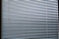 Blinds, texture blinds. Texture blinds office. White closed jalousie at day illumination. Blinds plastic texture background Royalty Free Stock Photo