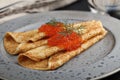 Blinis with red caviar