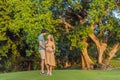 A blissful moment as a pregnant woman and her husband spend quality time together outdoors, savoring each other's Royalty Free Stock Photo