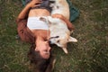 Blissful moments, a young woman and her Corgi savor serene outdoor companionship