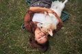 Blissful moments, a young woman and her Corgi savor serene outdoor companionship