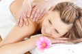 Blissful young woman enjoying a back massage Royalty Free Stock Photo