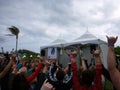 Blissologist Eoin Finn leads group of yogis in a shaka