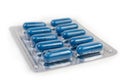 Blister pack with blue pills, close-up in selective focus Royalty Free Stock Photo