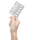Blister pack of pills in hand Royalty Free Stock Photo
