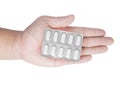 Blister pack of pills in hand Royalty Free Stock Photo