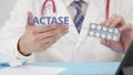 Medical doctor talks about Lactase tablets in his office. Telemedicine session with a patient