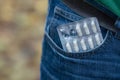 Blister of pills in back jeans pocket Royalty Free Stock Photo