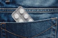Blister of pills in jeans pocket, first aid and daily medication Royalty Free Stock Photo